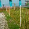 Hotline 50m Plastic Fencing Mesh Roll Orange in use